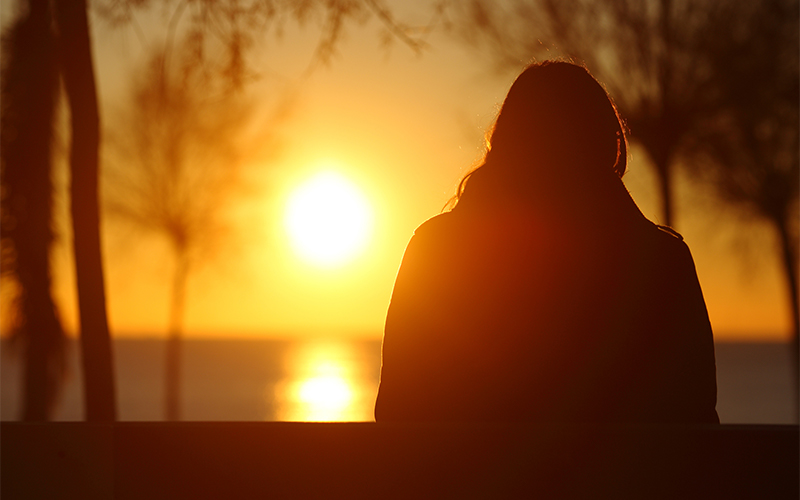 Person looking at sunset