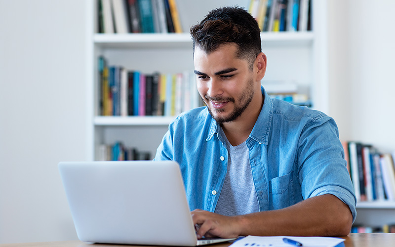 Man working on his laptop from home