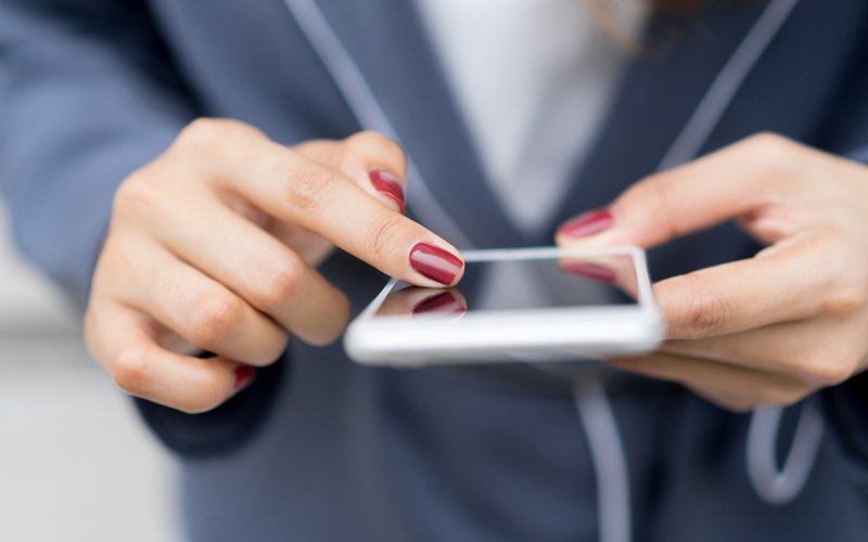 Hands using a smartphone