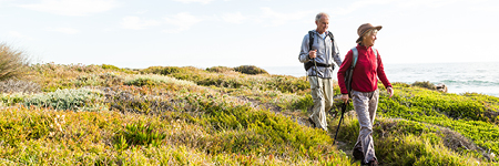 Senior couple hiking along