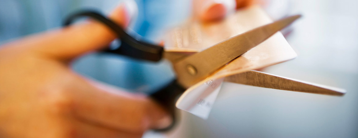 Cutting a credit card with scissors